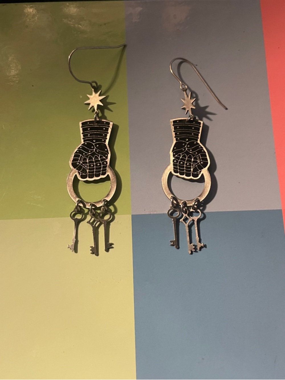 While Odin sleeps silver fist and keys earring pair